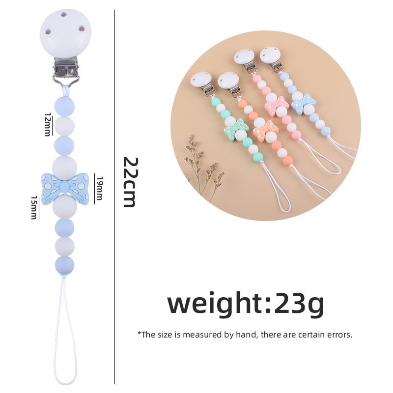 Suministros para bebés hemu clip de chupete calmante bebé de dibujos animados arco mordedura pegamento cadena de chupete cadena anti-caída nueva