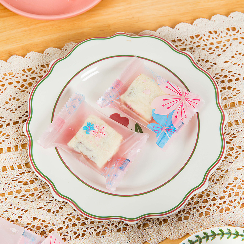 Copo de nieve de poliéster máquina crujiente sello autosellante embalaje turrón galleta embalaje transparente azufaifo leche bolsa de embalaje 100 piezas