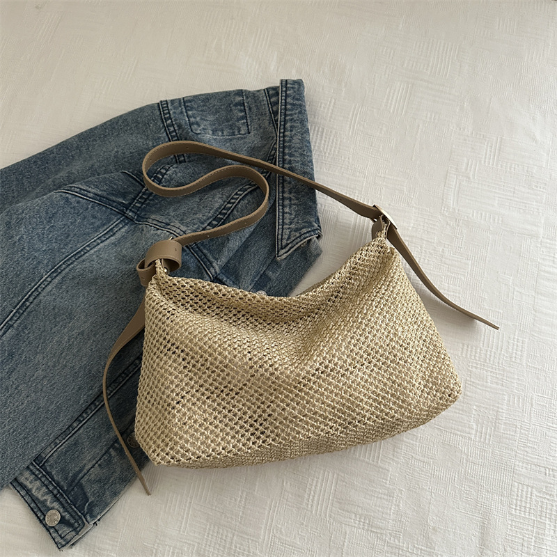 Nicho de alta sensación de bolso de tejido para mujeres 2024 nuevo tipo de viaje al trabajo bolso de paja de hombro de gran capacidad bolso de mochila