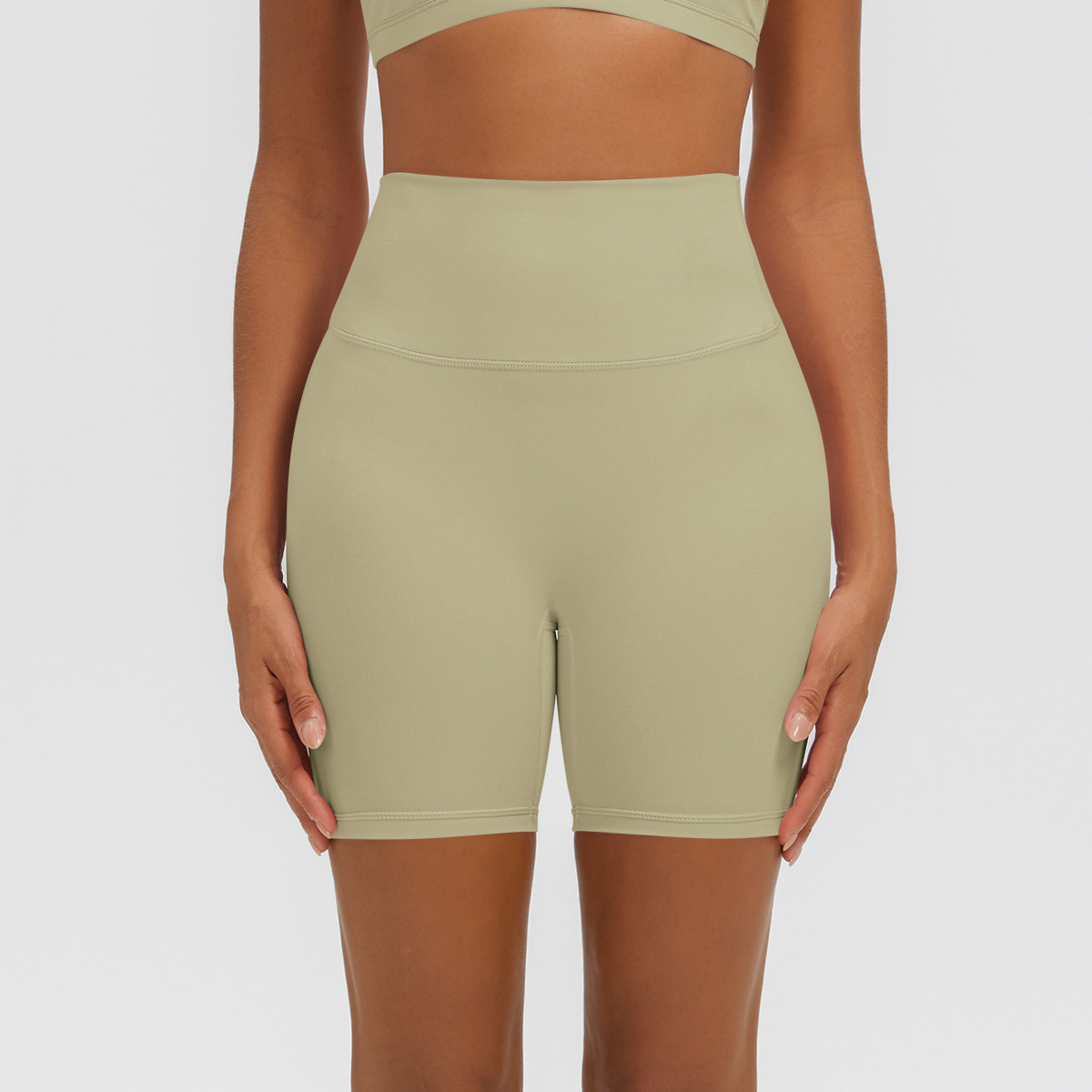 Nuevo tipo delgado de hielo, piel transpirable, ajustado, color sólido, ropa de yoga, pantalones cortos de tres puntos.