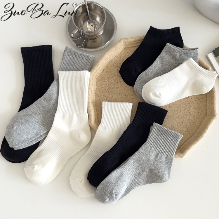 Socks spring and autumn breathable sweat-absorbent deodorant men and women ins black and white solid color tube high tube lovers boat socks cotton socks wholesale