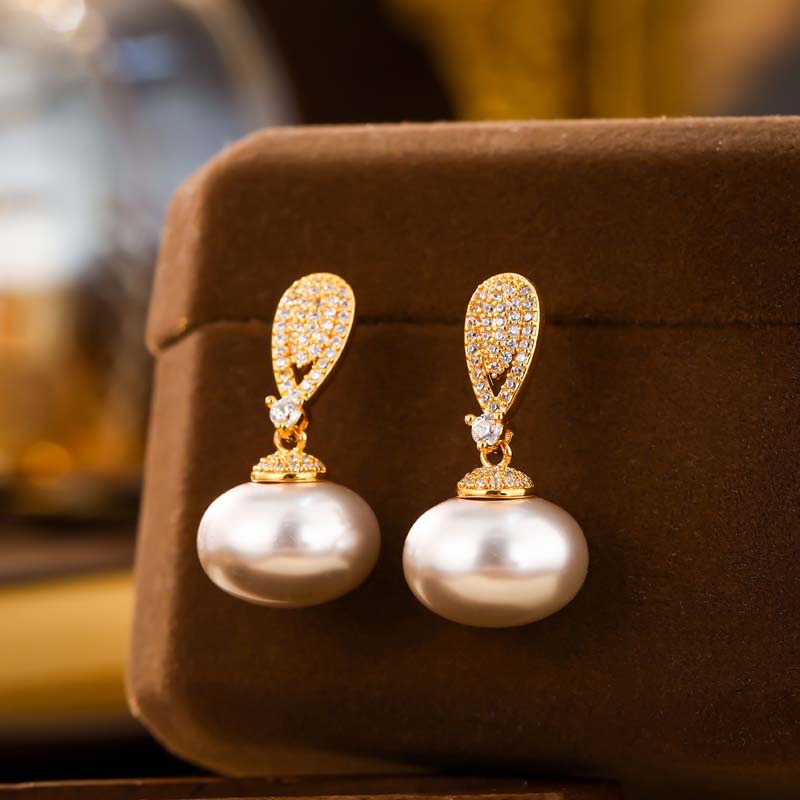 Elegant earrings with zircon drop-shaped from pearl