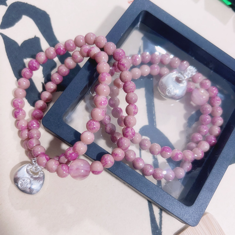 Bracciale con perline rosa e ciondolo portafortuna donna_voghion.com