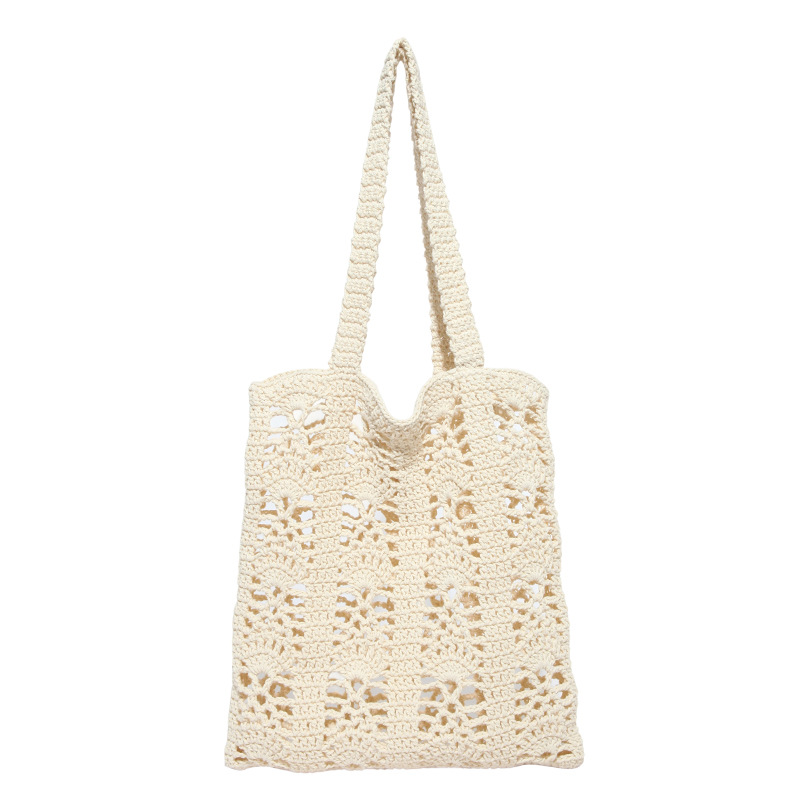 Versión coreana del bolso de nicho 2025 verano nuevo bolso femenino flor tejido bolso de hombro hueco de gran capacidad