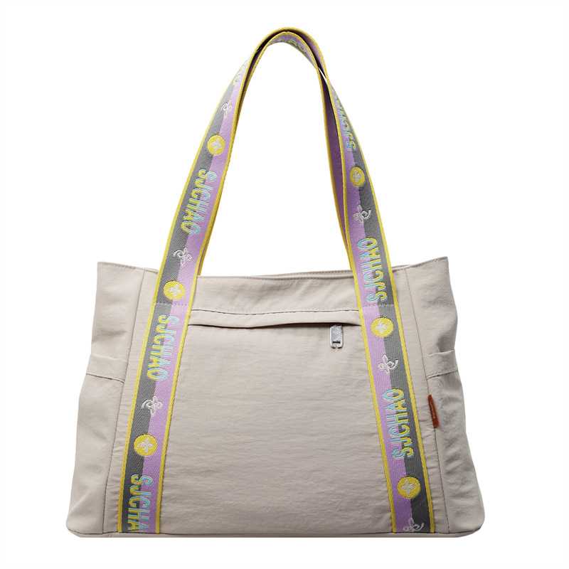 Bolso Tote portátil horizontal de tela de nailon para mujer 2025 nueva moda casual todo fósforo bolso de hombro de trabajo