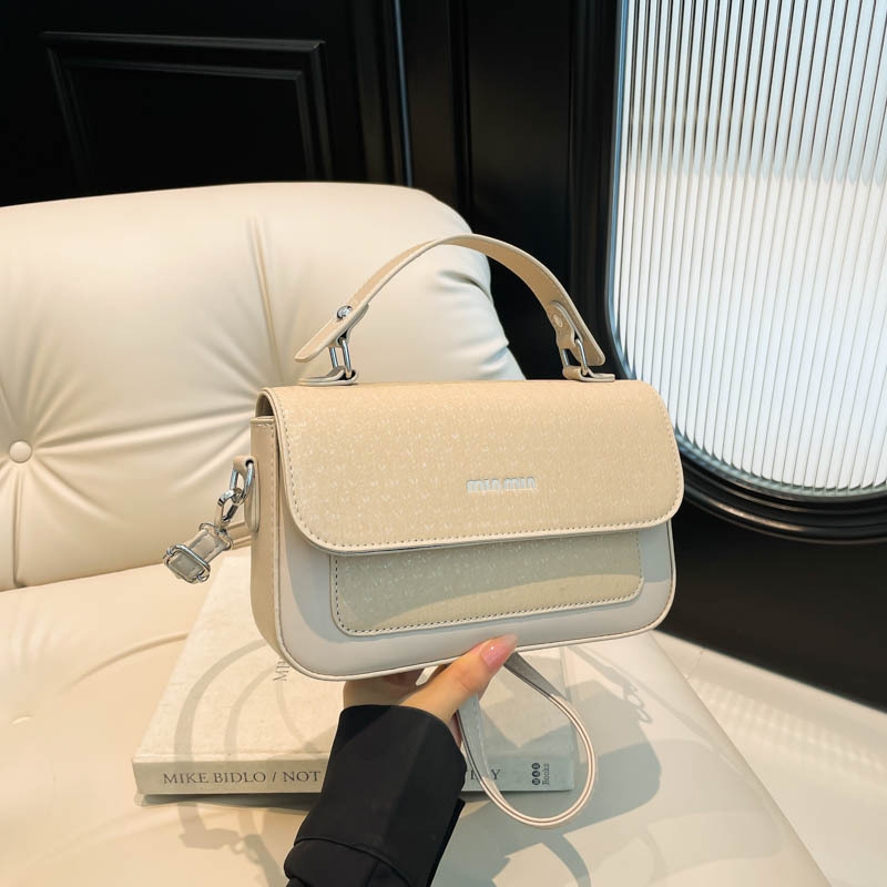 Textura al por mayor de lujo ligero bolso de mano bolso de mujer otoño 2025 nuevo estilo extranjero empalme bolso de hombro bolso de viaje