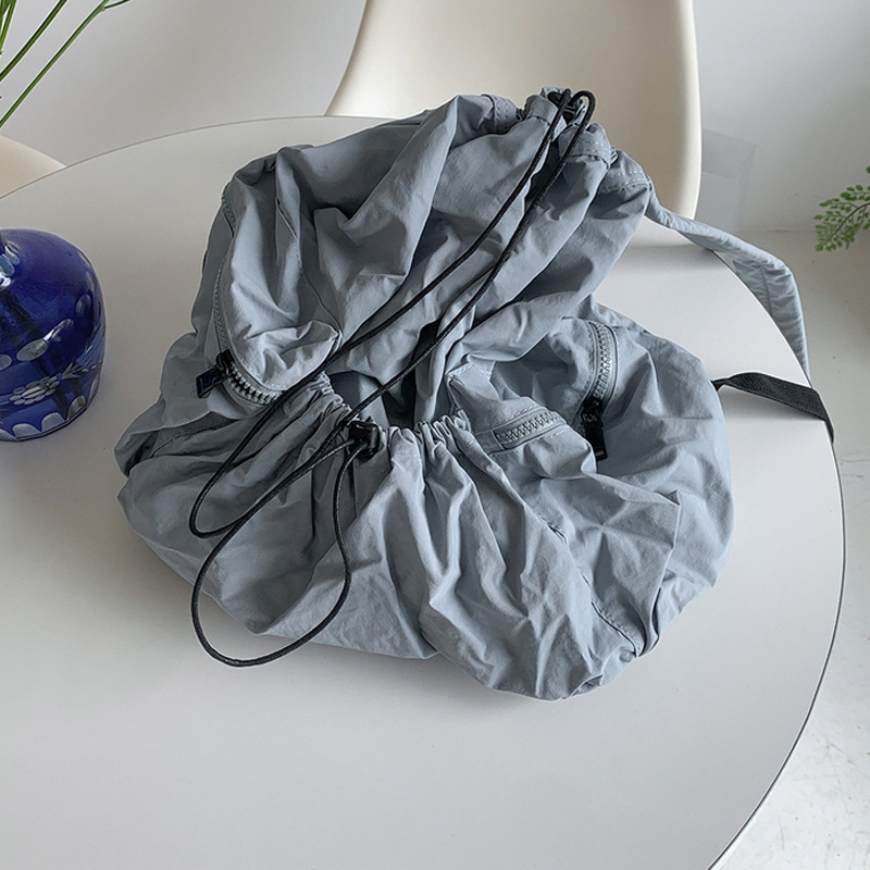 Corea del Sur Dongdaemun nuevo cordón mochila mujer casual gran capacidad estudiante mochila versátil mochila de nylon ligero