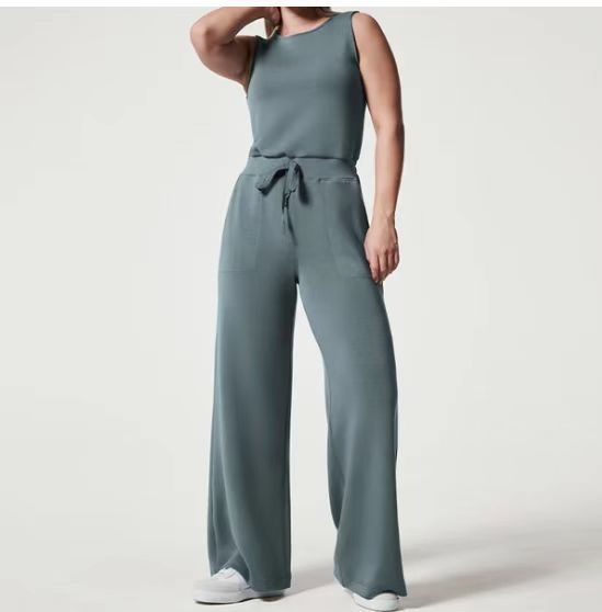 Ropa de mujer transfronteriza europea y americana 2023 ropa de mujer de verano nuevo color sólido pantalones de mono elástico de encaje sin mangas de todo fósforo
