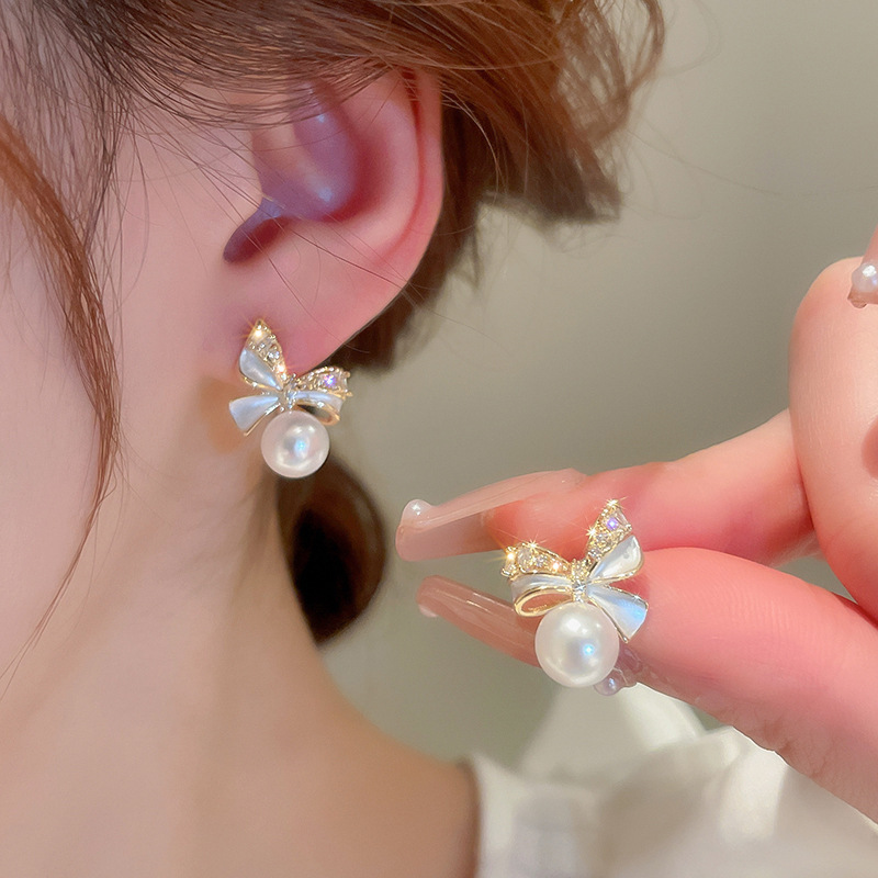 Pendientes de perlas de flor de circón de aguja de plata, pendientes de lujo de alta gama de lujo ligero exquisito, pendientes de todo fósforo blanco de moda de nicho al por mayor
