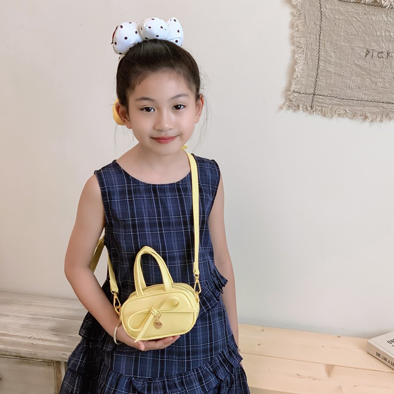 Coreano simple color sólido bolso de hombro para niños y niñas mini bolso de bebé lindo dulce bolso de arco para niños