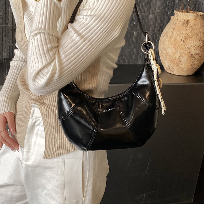 Transfronterizos coreanos perezosos bolsas de brazo de cera nicho bolsas de cuerno de piel de cera 2026 nuevas bolsas de brazo diarias mujeres