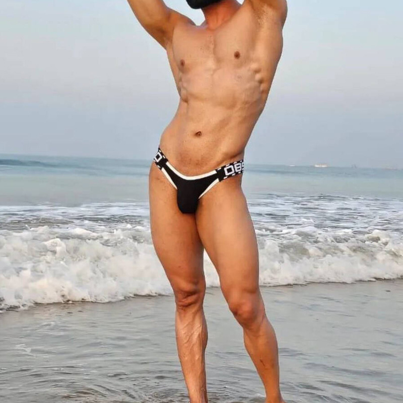 Sexy and Unique Men's Bs3209 Low-Rise Ribbed Cotton Double-Layer Butt-Lifting Waistless T-Back Bikini with Open Back and Small Triangle Shape