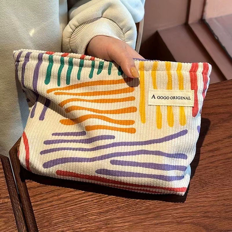 Handheld storage system, cosmetic bag, shopping bag, travel bag