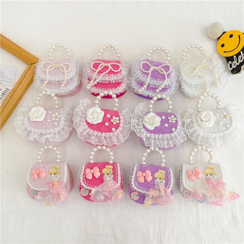 2022 nuevas niñas bolso de perlas de dibujos animados lindo arco princesa bolso de hombro estilo occidental encaje pequeño bolso de hombro