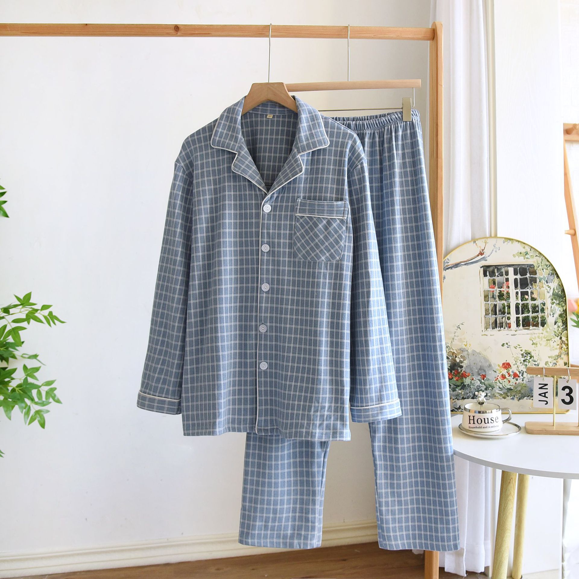 春と秋の冬の新型デコルテのカップルの長袖のズボンの家庭服は簡単でカジュアルな大きいサイズの男性の女性のパジャマのスーツです。