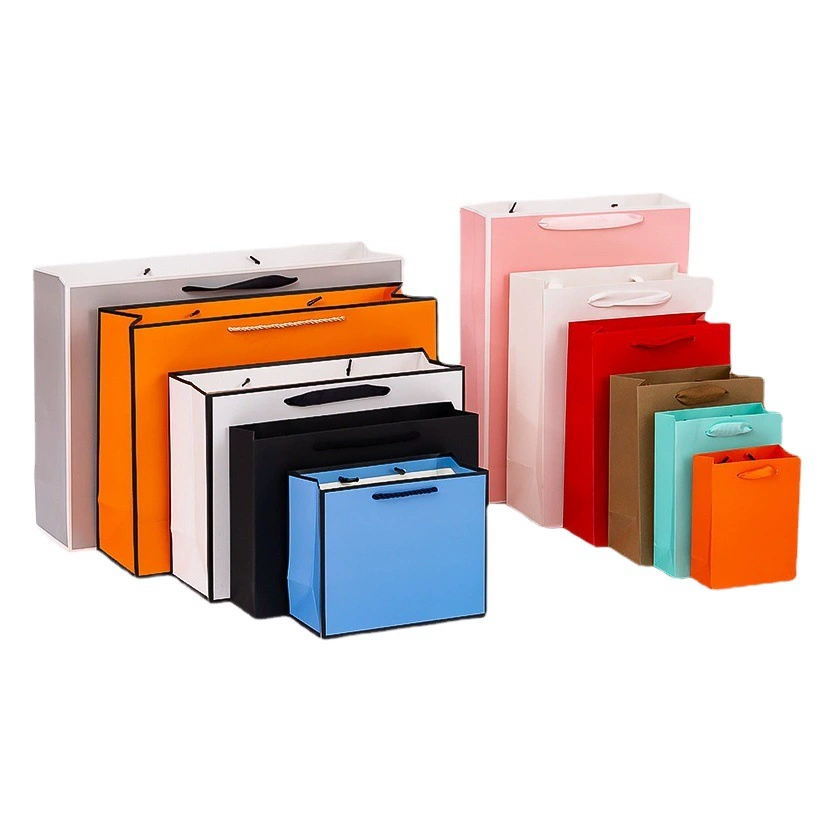 Оптовая оптовая продажа утолщенных подарочных крафт-бумажных мешков для одежды, упаковочных мешков для женских покупок, крафт-бумаги, белая карточная сумка