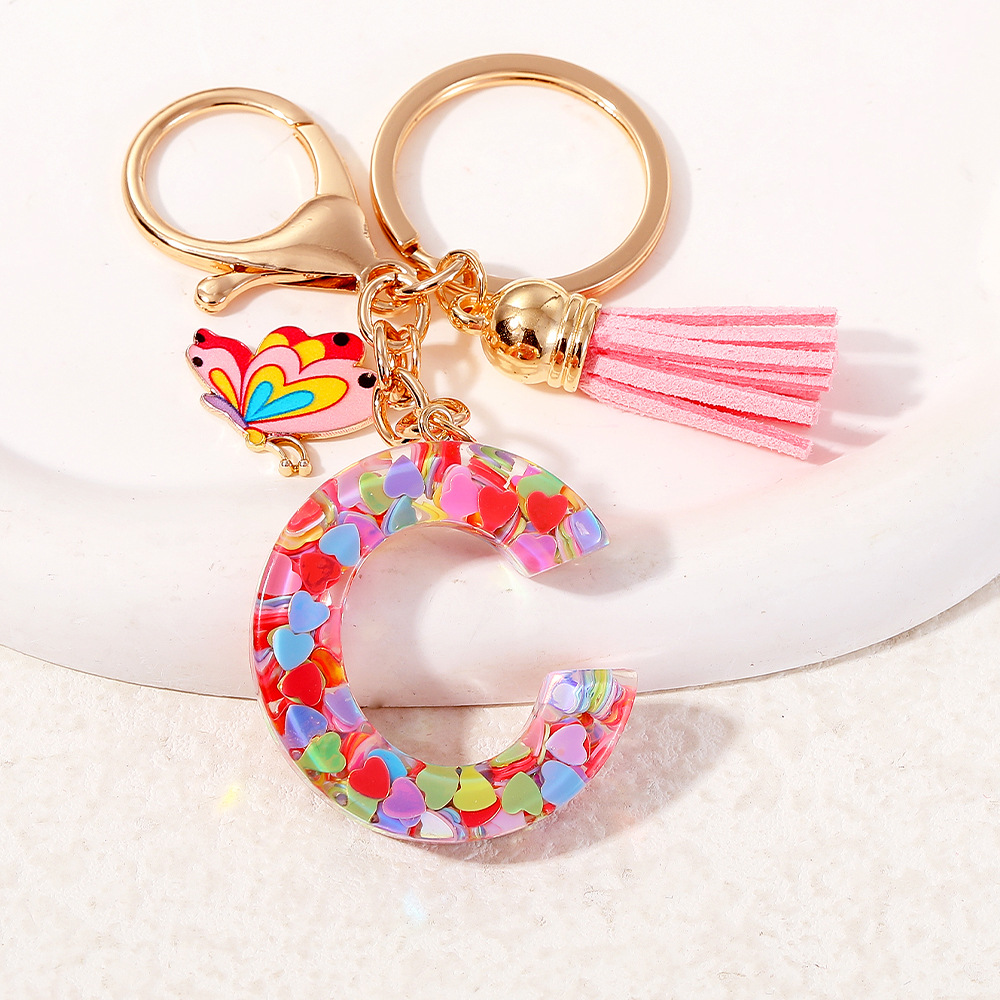 2024 puntos transfronterizos de resina de sequilla rosa 26 letras inglesas llavero colgante mariposa fringe accesorios