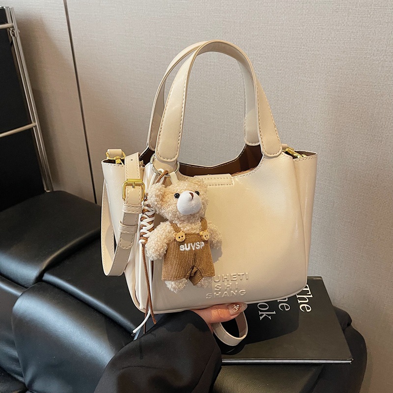 Vintage Maillard bolso de mano para mujeres 2025 nuevo estilo transfronterizo popular aceite cera cuero bolso de cubo textura mochila