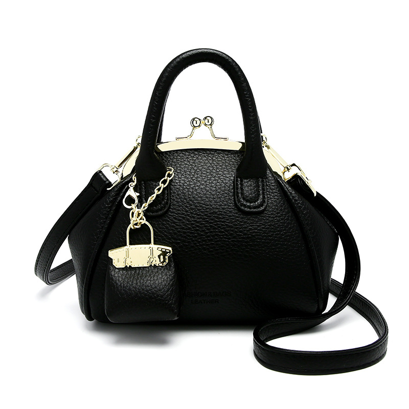 Venta al por mayor primavera y verano nuevo estilo bolso femenino retro bolso de clip bolso de mano moda todo fósforo bolso pequeño de mensajero de un solo hombro femenino