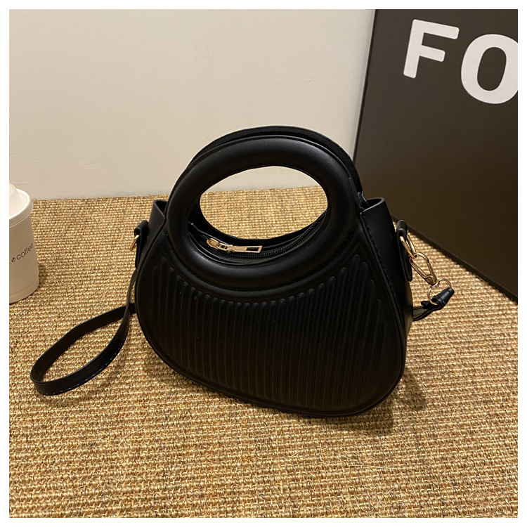 Fresco dulce dopamina color sólido rayas bolso de las mujeres este año popular pu estilo occidental bolso de hombro redondo
