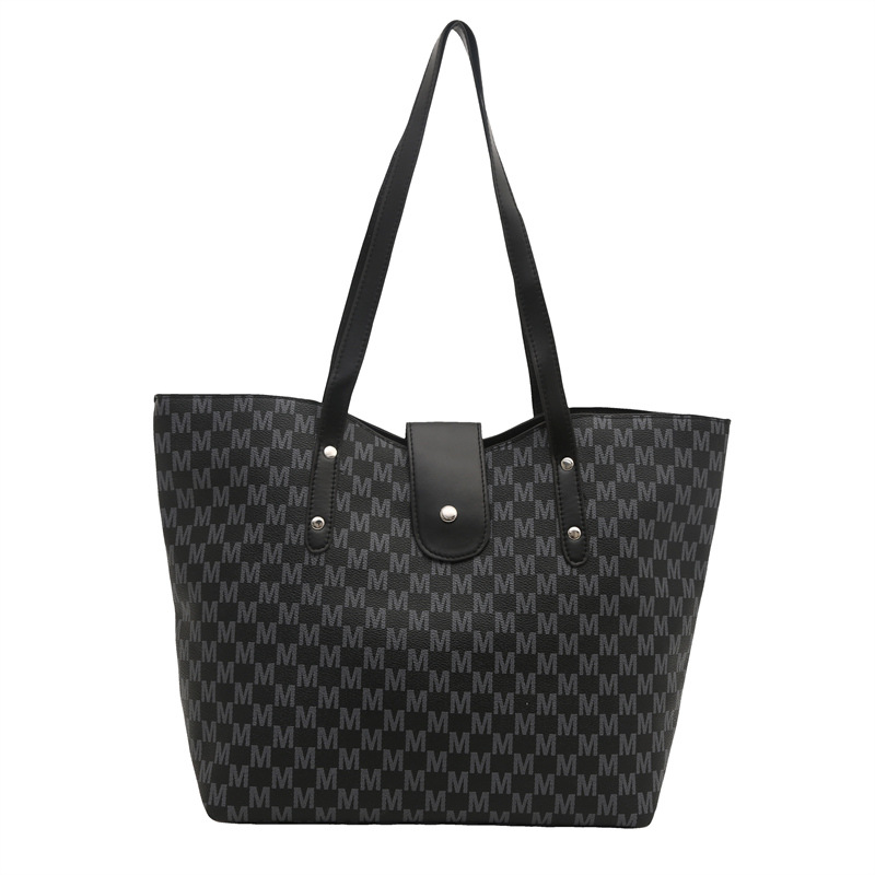 2025 primavera y verano nuevo tipo de gran capacidad portátil bolso de hombro, nicho de diseño casual, moda simple bolso de brazo