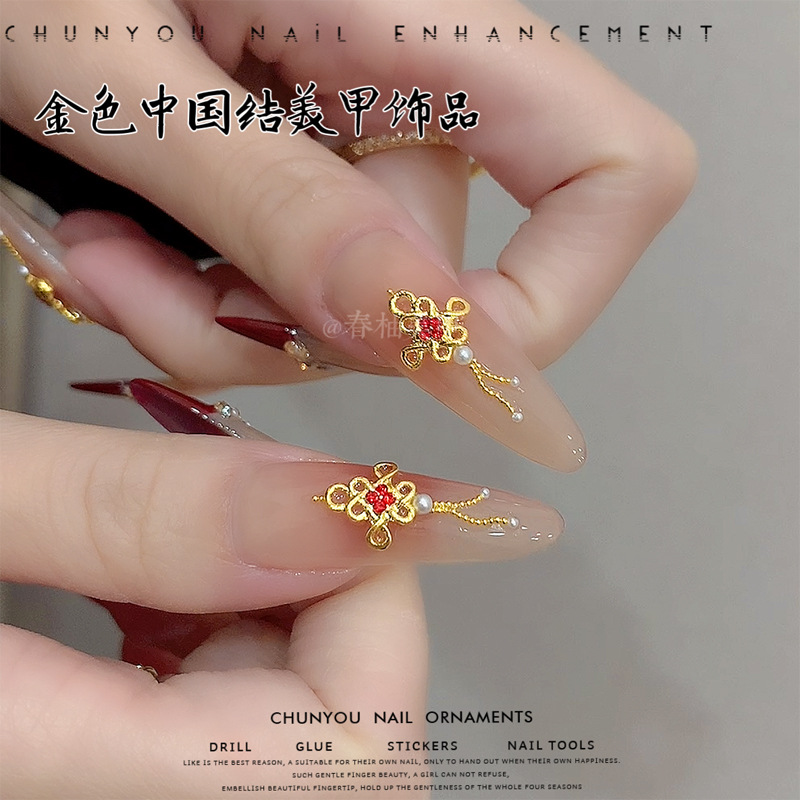 Nuevos joyas de uñas de oro de China marcha nacional con diamantes rojos accesorios de uñas de Año Nuevo taladro
