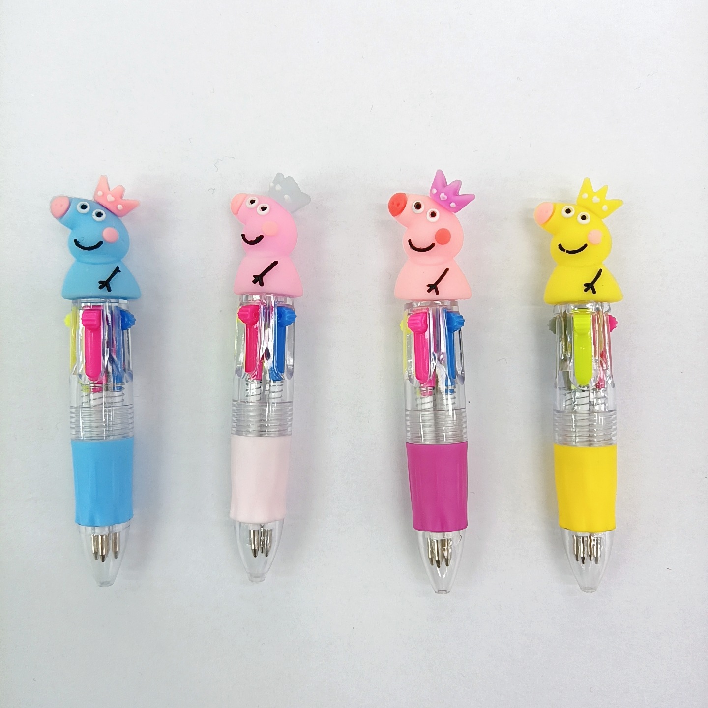 Fabricante mayorista de cuatro colores bolígrafo de silicona bolígrafo multicolor de dibujos animados cabeza portátil de estudiantes