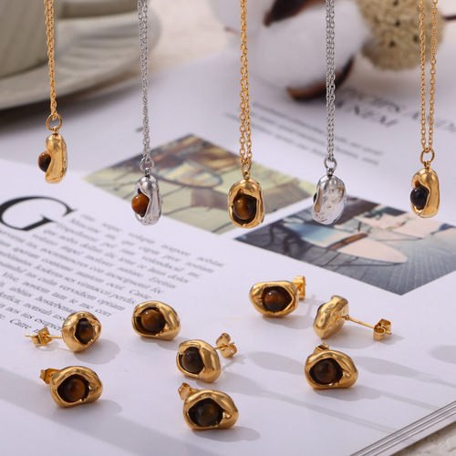 Vintage English-style niche accessory with an indented elliptical pendant featuring tiger's eye stone, designed titanium steel jewelry set