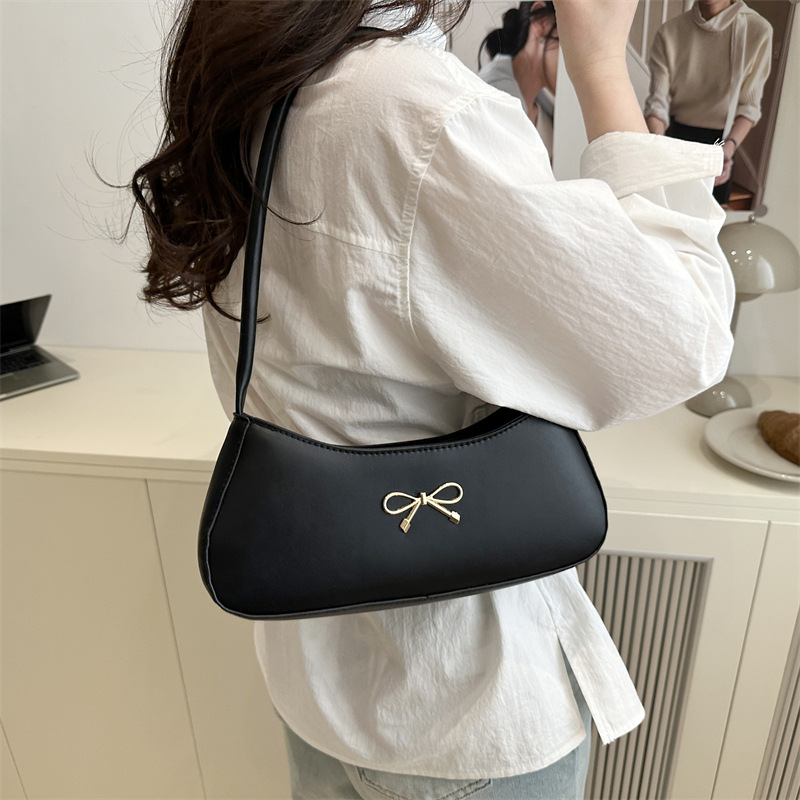 Bolso de axila con lazo para mujer 2025 nuevo bolso de bola de masa de lujo simple y ligero de alta calidad textura bolso de mensajero de un solo hombro marea