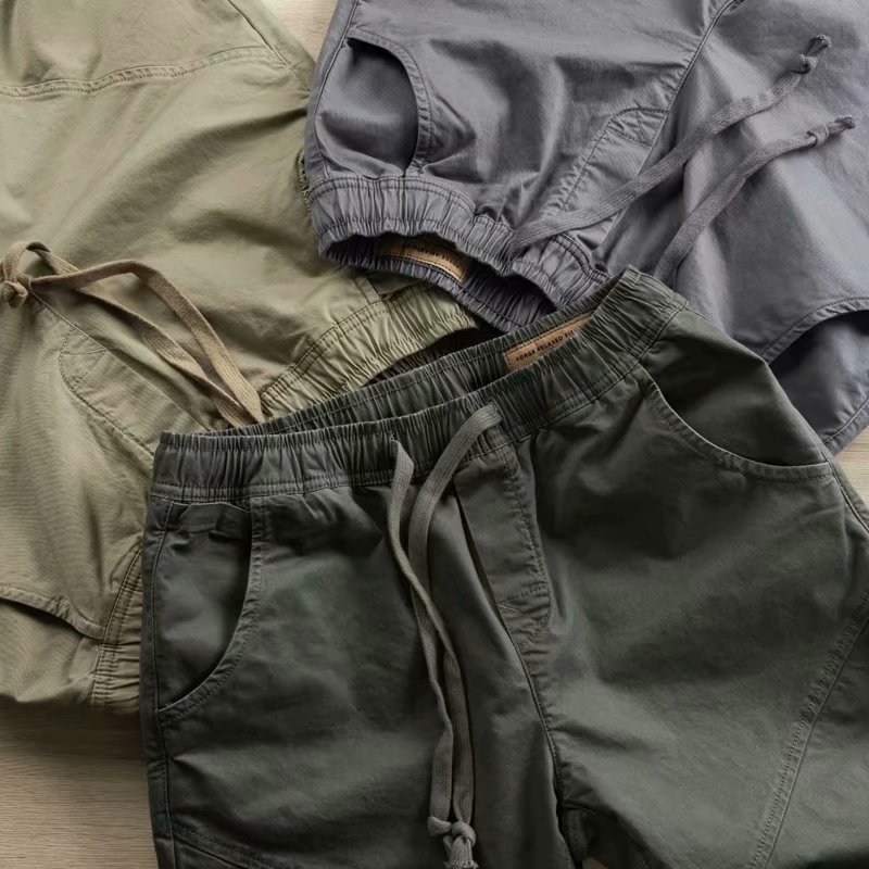 Estilo coreano de color sólido overoles marca de moda para hombres pantalones de protección laboral atados al tobillo primavera y otoño pantalones casuales sueltos para hombres entrega de una pieza
