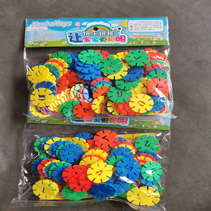 Bloque de copo de nieve de jardín de infancia al por mayor transfronterizo montaje puesto de juguete de escritorio a granel rompecabezas tubo de rueda