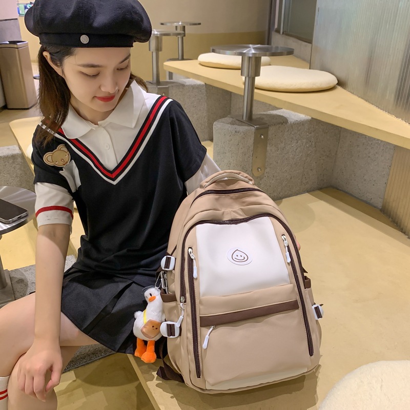 Mochila de lona coreana simple y versátil para mujeres 2023 nueva bolsa de gota de lluvia de gran capacidad mochila de ocio mochila de estudiantes