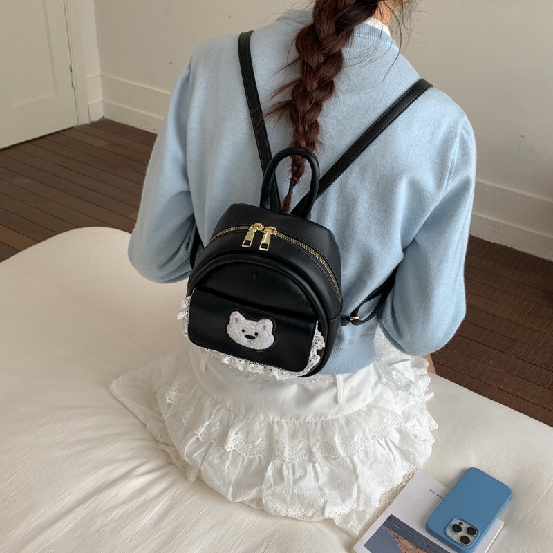 Mujeres nuevas estilos de dibujos animados simples estudiantes 2026 verano universal mochila ligera oso mochila encantador viaje coreano