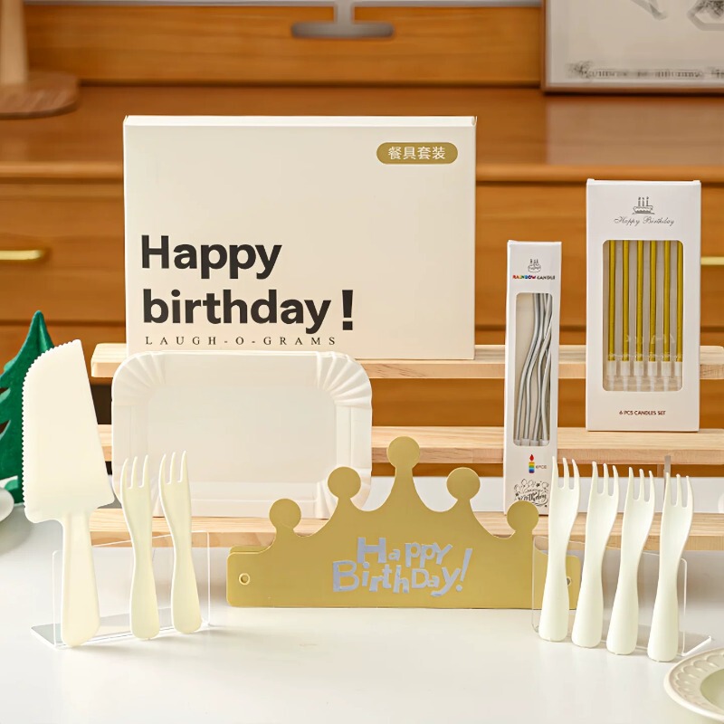 Birthday cake, serving platter, candles, decorations, party supplies, gold and silver birthday hats, disposable cutlery and plates, tableware set