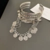 Silver bracelet with tassels