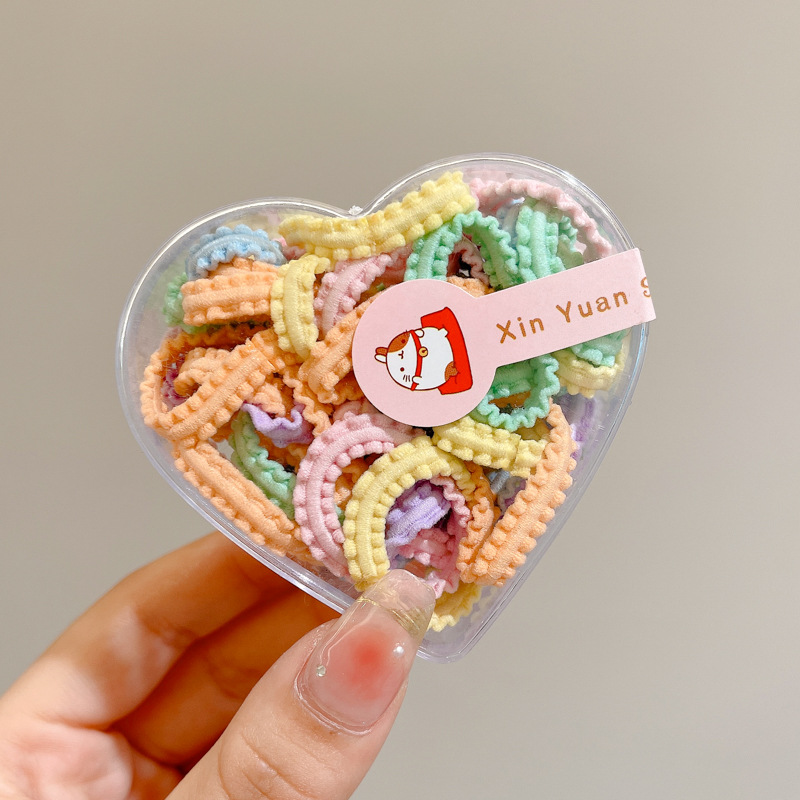 Las muchachas de la cuerda del pelo del color del caramelo no hacen daño al pelo pequeña tira de goma Lazo de la cuerda del pelo tocado niños lindos cubierta de cuero de la banda del pelo del bebé