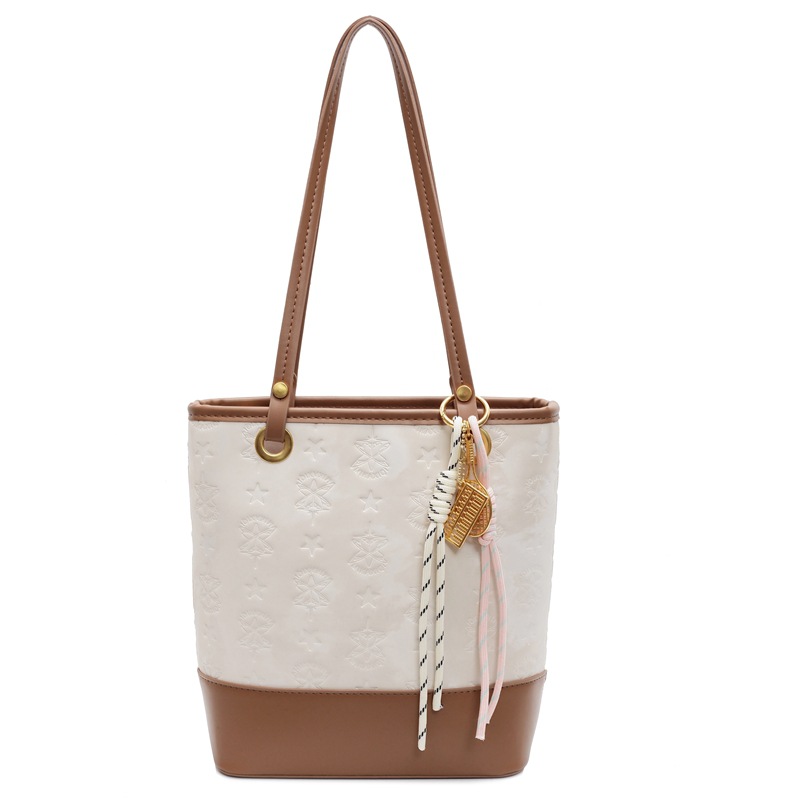 Bolsa de cubo de moda coreana para mujeres 2025, nuevo diseño universal de nicho para viajar bolso de hombro de moda bolso de mujer casual