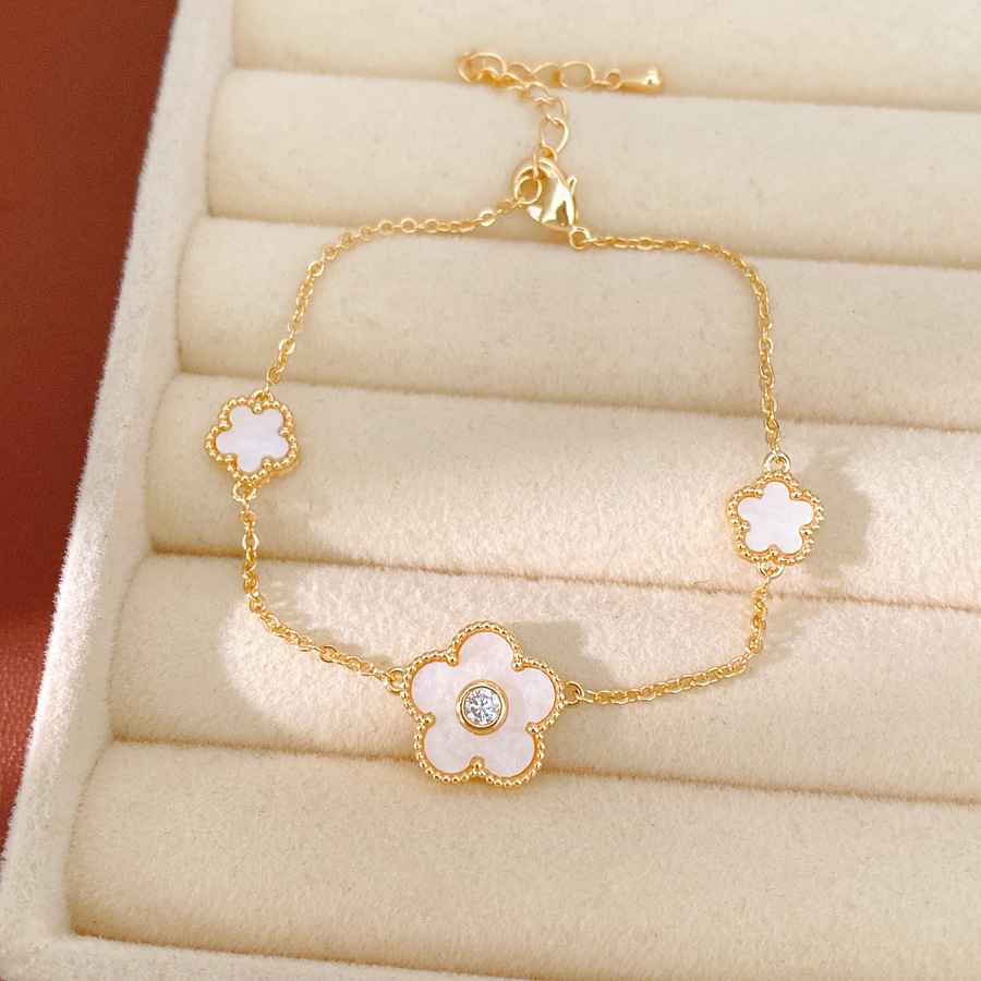 Collar de orejas de piedra de oro real, collar de orejas de flores de lujo ligero, collar de clavícula de nicho, conjunto de joyas simples y dulces.