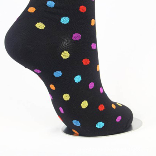 Leg pressure socks set, including calf socks with polka dot and striped compression socks.