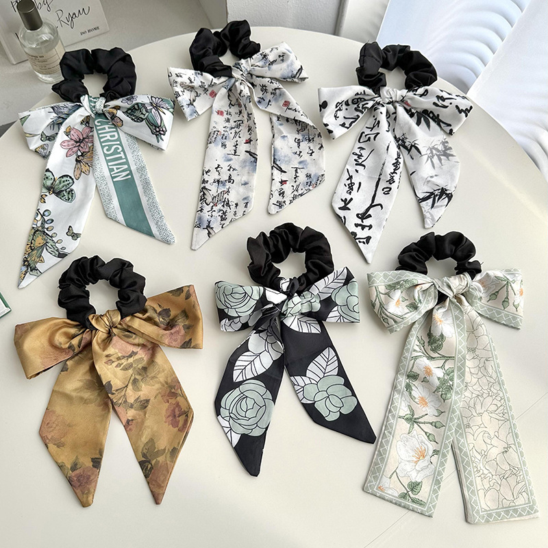 Anillo de cabello de arco femenino retro elegante correa francesa temperamento de alta sensación de impresión de anillo de intestino suave tocado versátil