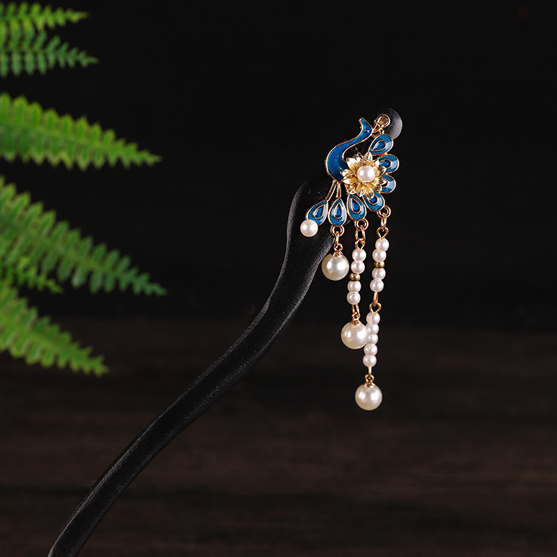 A blue peacock hairpin