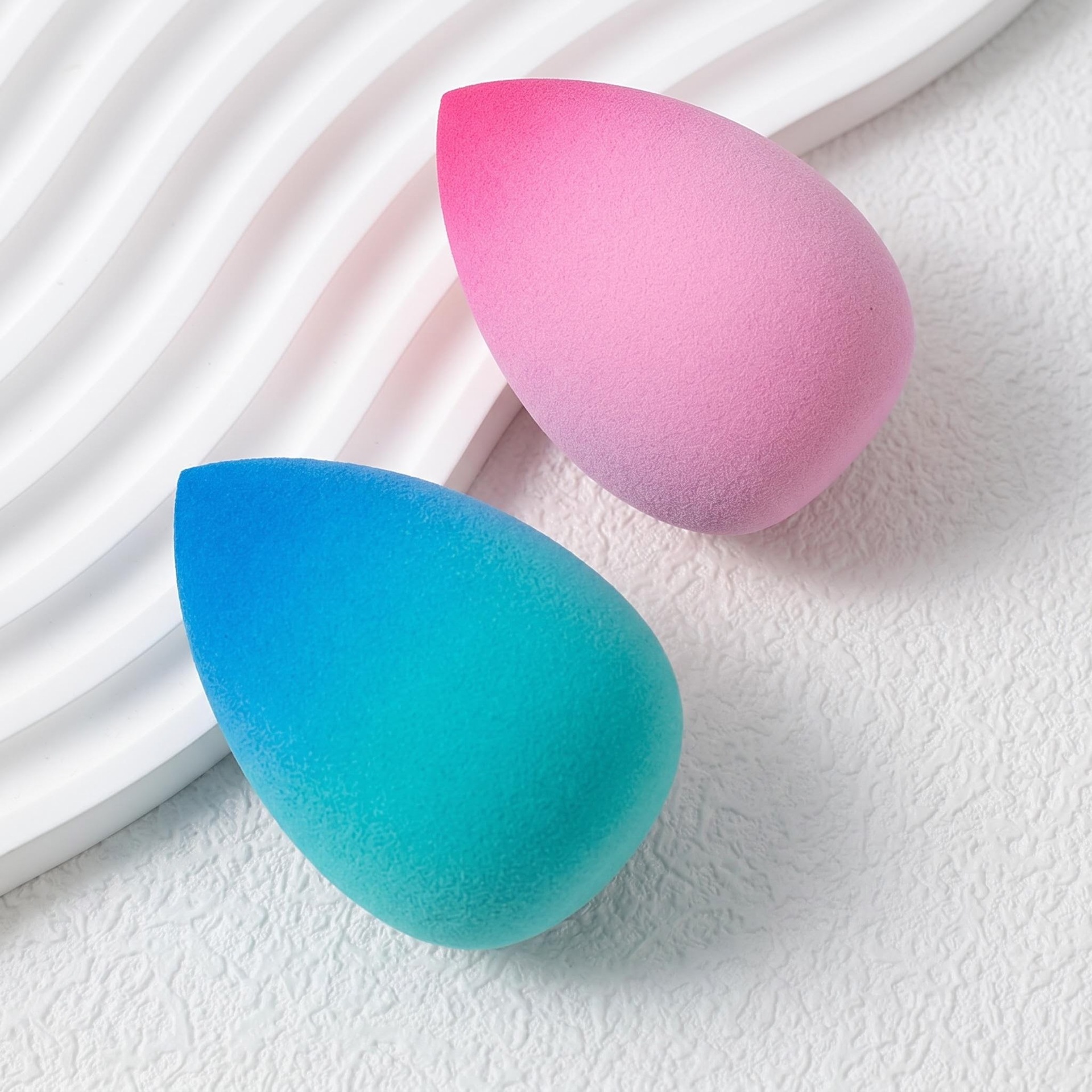Fábrica personalizada huevo de maquillaje gradiente super suave no comer polvo seco y húmedo doble uso de agua gota de maquillaje huevo al por mayor
