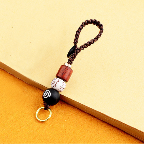 Embrace the power of the Five Emperors' coins with this lucky charm keychain, featuring a hand-woven rope, turning wheel, and vibrant design. Perfect as a retro-style accessory for keys, adding a creative and mystical touch to your everyday life.
