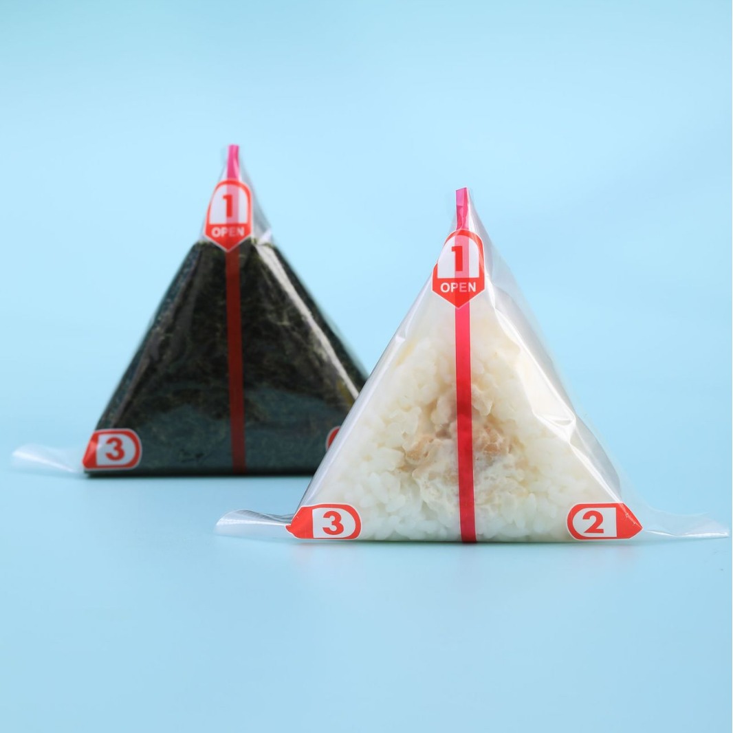 Fábrica directa de doble capa de bolsas de arroz triangular se puede calentar fácilmente desgarrar la bolsa de embalaje de sushi desechable de calidad de alimentos