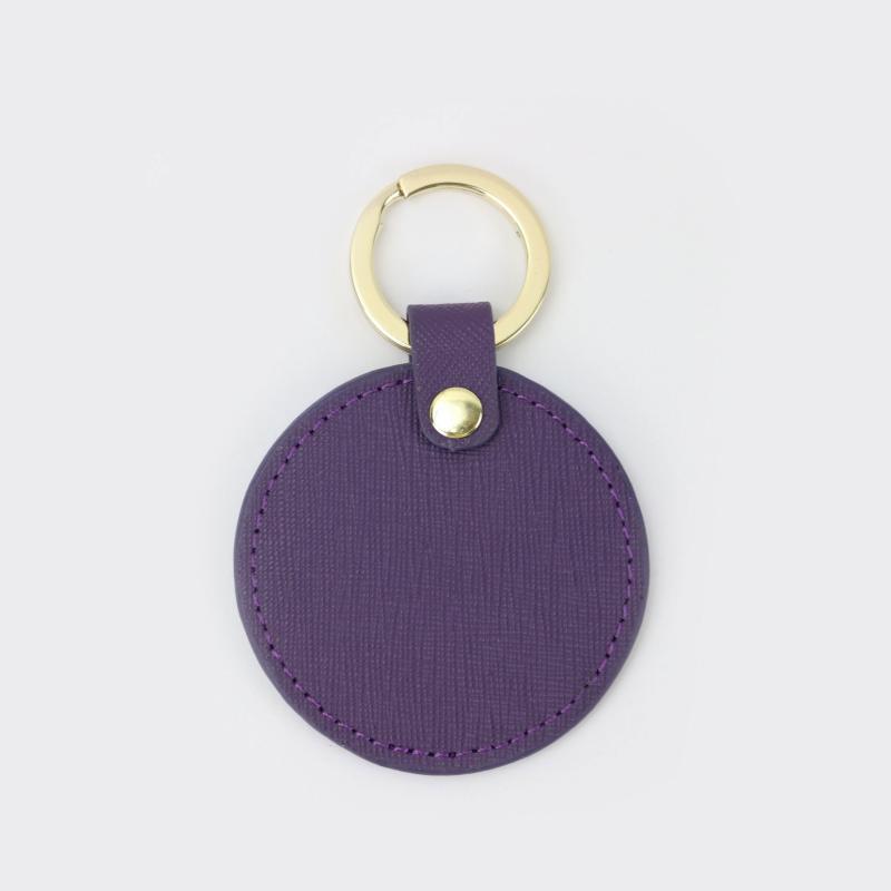 Llavero redondo de cuero genuino personalizado creativo simple colgante hombres y mujeres pequeño exquisito pequeño regalo al por mayor todo a juego