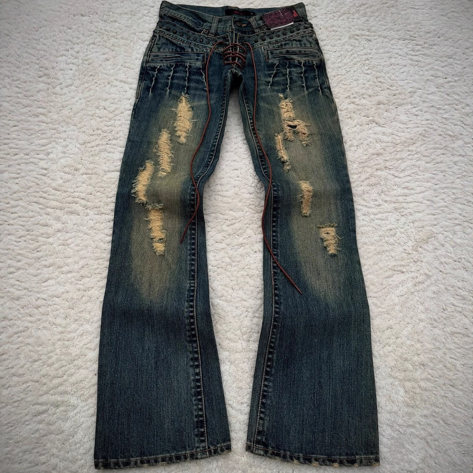 Vaqueros lavados milenarios de verano transfronterizos europeos y americanos estilo gótico retro micro-cuerno pantalones de cintura para hombres y mujeres en la calle