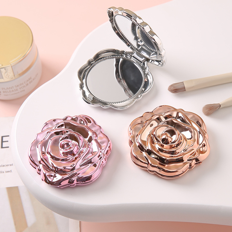 Nuevo modelo de galvanoplastia portátil rosa pequeño espejo de maquillaje espejo mini portátil de doble cara portátil espejo plegable de mano