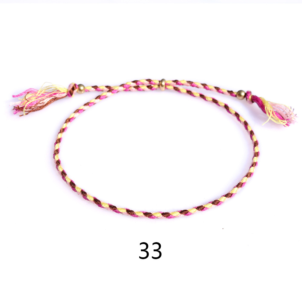 Amazon popular colorido cuerda de algodón amistad pulsera perlas de cobre borla pulsera tejida a mano ajustable hombres y mujeres pulsera