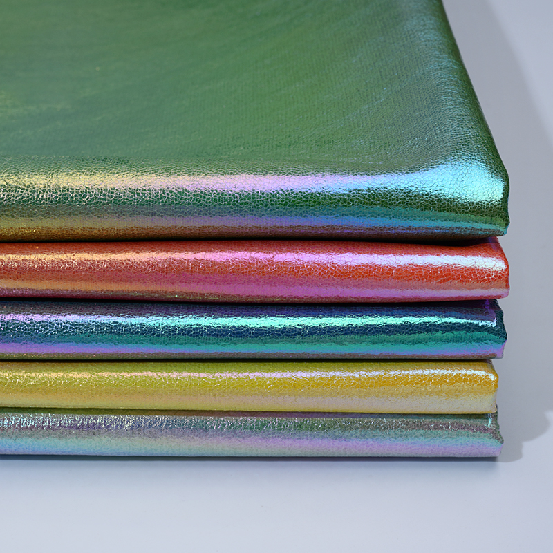 新品幻彩镭射渐变彩虹爆裂纹PU皮革反光服装舞台软包箱包帽子面料