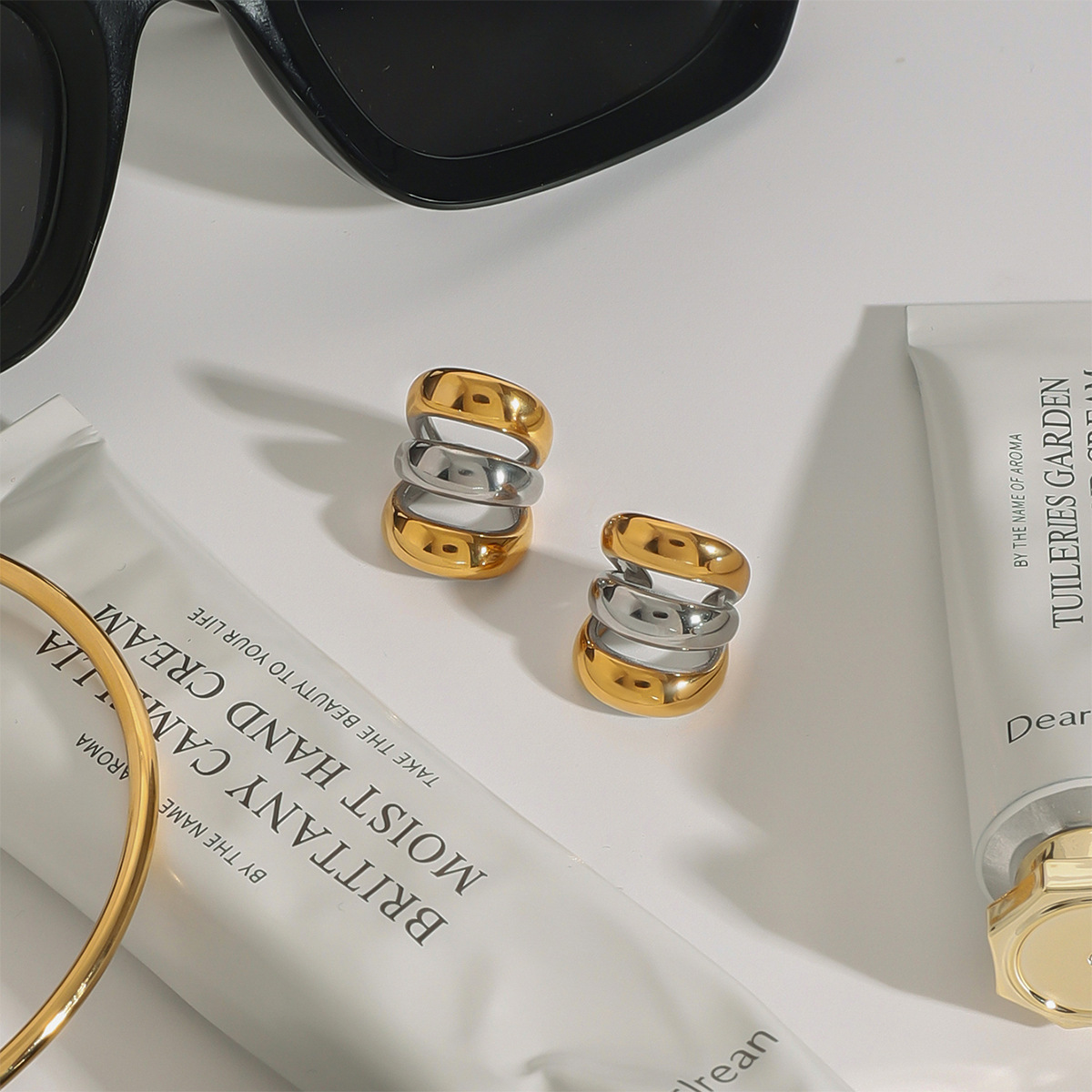 JEDING Europa y América de acero inoxidable de color hueco no agujero de alto nivel nicho pendientes de acero de titanio pendientes transfronterizos